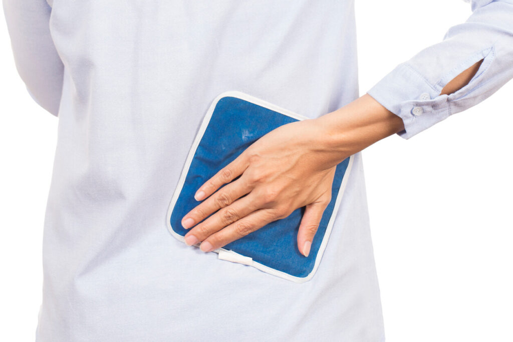 woman-holding-ice-pack-on-lower-back-arthritis